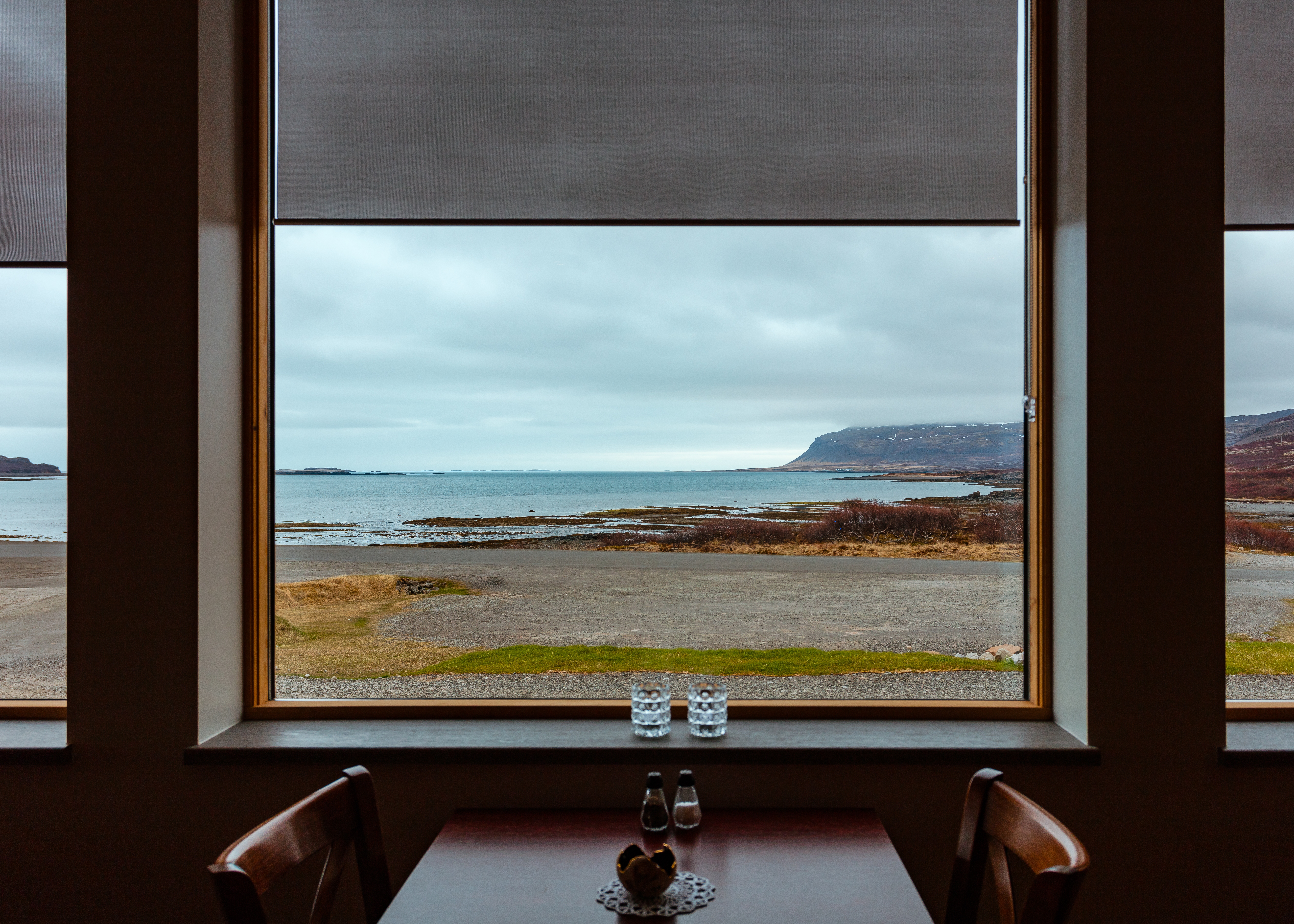 a dining room with a view of the beach